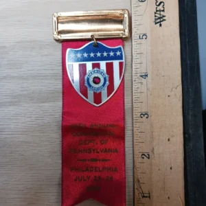 The product is a vintage military pin from 1958, specifically an American Legion Award pendant pin.