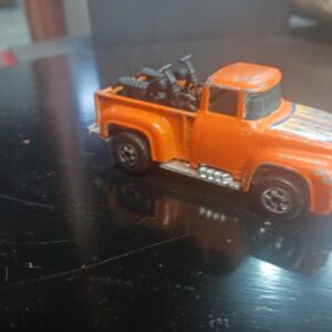 Vintage 1973 Hot Wheels Orange Truck with 2 motorcycles in back Hong Kong